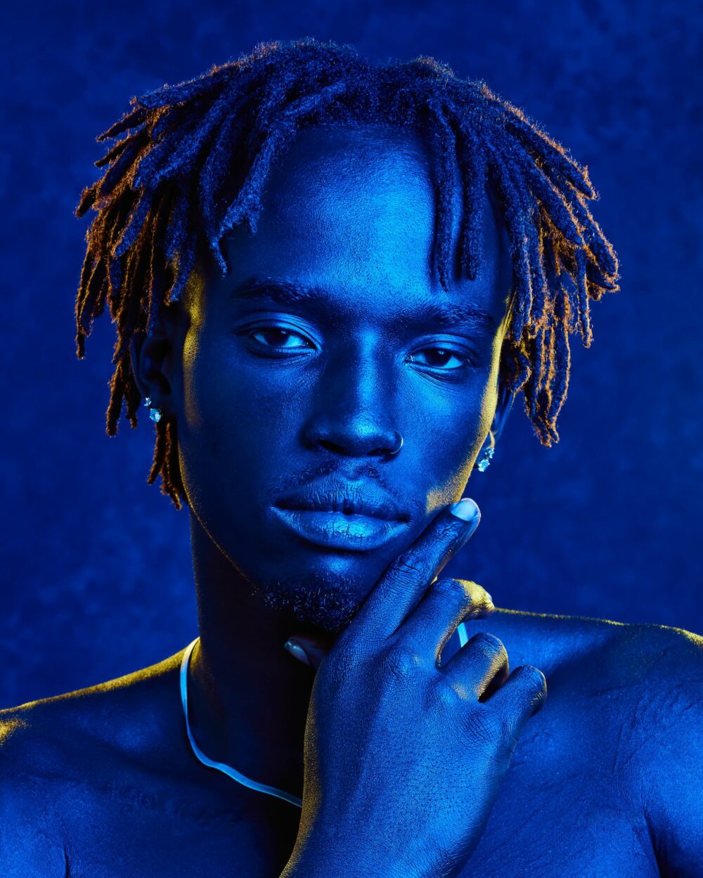 portrait of a male model with blue light