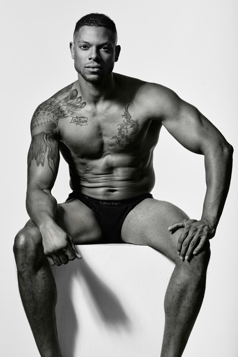 Black and white image of a muscular male model