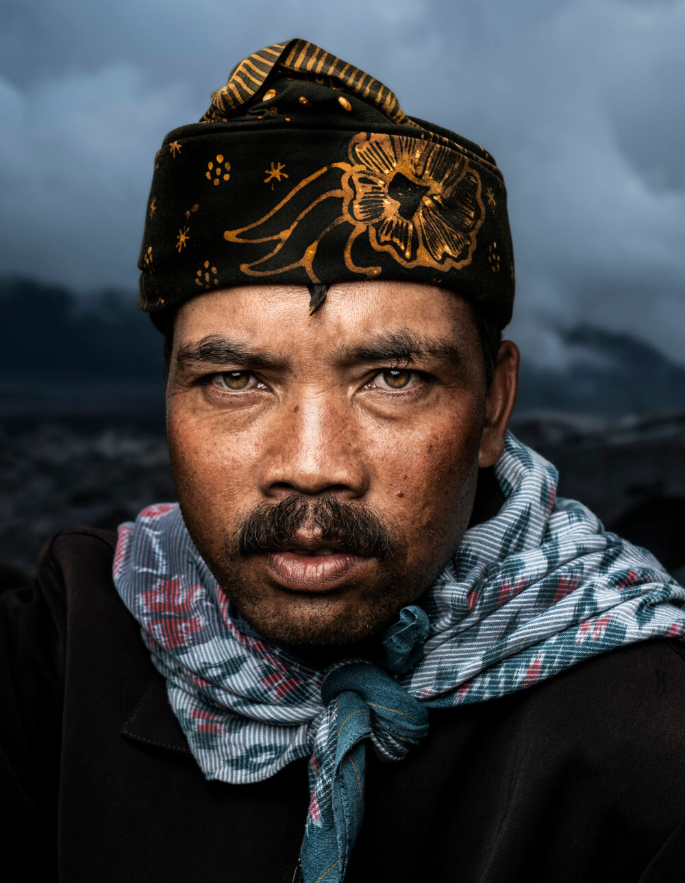 portrait of an indonesian man on mount Bromo